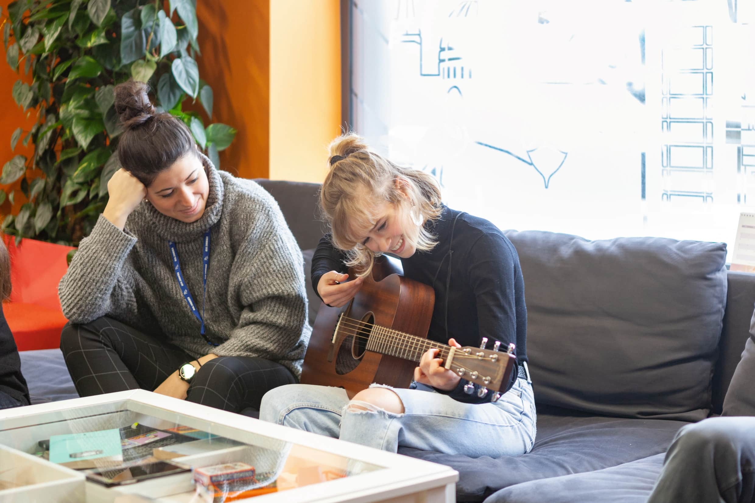 Ec dublin girl playing guiter in lounge
